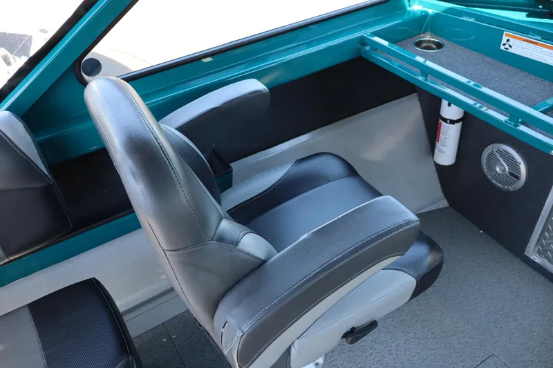 Slide: The Image of Interior of 2019 Northwest 208 SeaStar boat with gray seating and teal accents. - 12