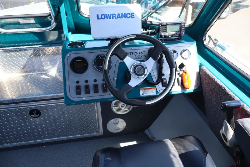Slide: The Image of Cockpit of 2019 Northwest 208 SeaStar boat with steering wheel and navigation equipment. - 14