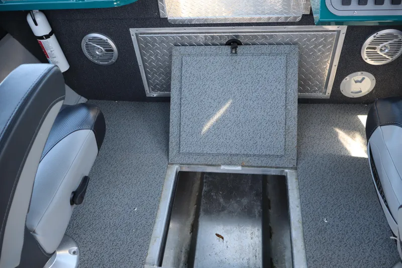 Slide: The Image of Interior of 2019 Northwest 208 SeaStar boat showing storage compartment and seating. - 16