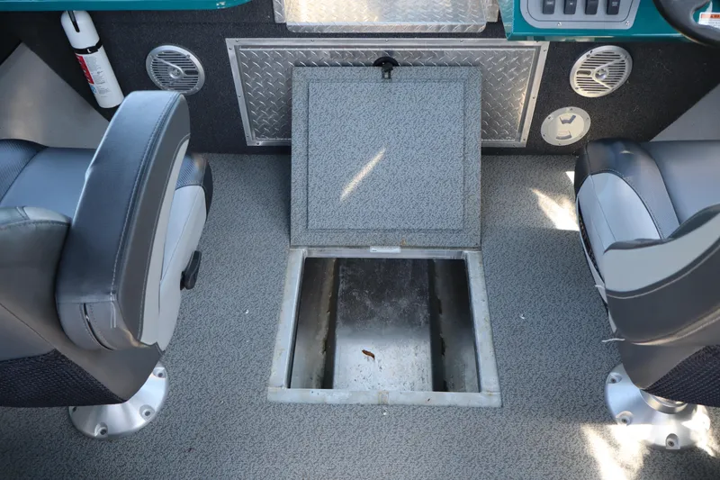 Slide: The Image of Interior of 2019 Northwest 208 SeaStar boat showing open storage compartment. - 17