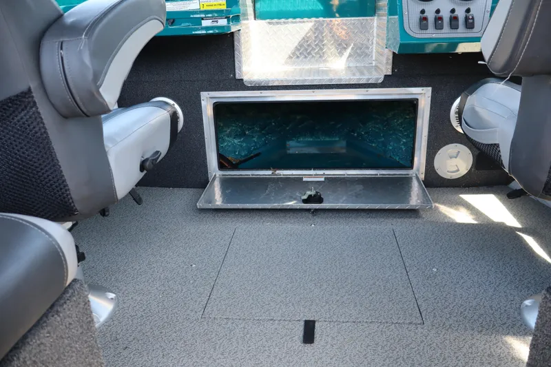 Slide: The Image of Interior of a 2019 Northwest 208 SeaStar boat showing seating and storage compartment. - 18