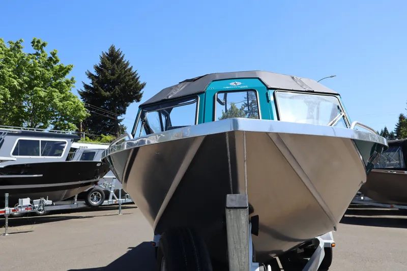 Slide: The Image of 2019 Northwest 208 SeaStar boat on trailer, parked outdoors under clear blue sky. - 20