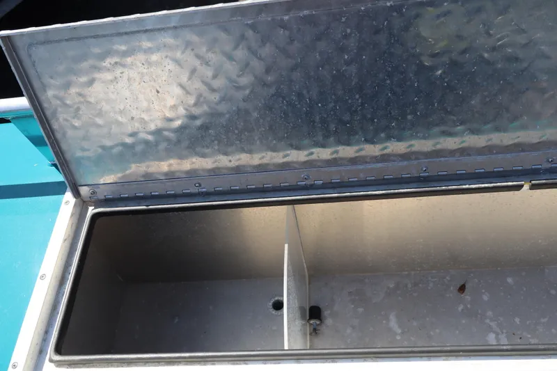 Slide: The Image of Open storage compartment on a 2019 Northwest 208 SeaStar boat. - 7