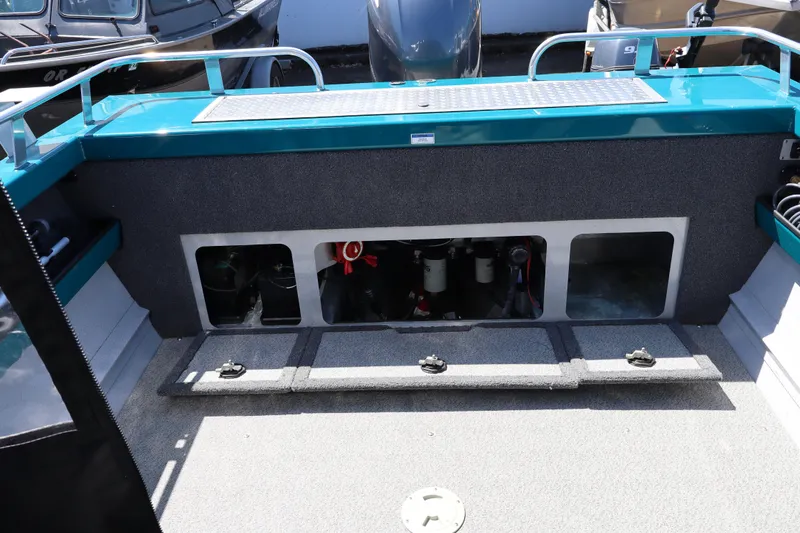 Slide: The Image of 2019 Northwest 208 SeaStar boat interior with storage compartments open. - 9