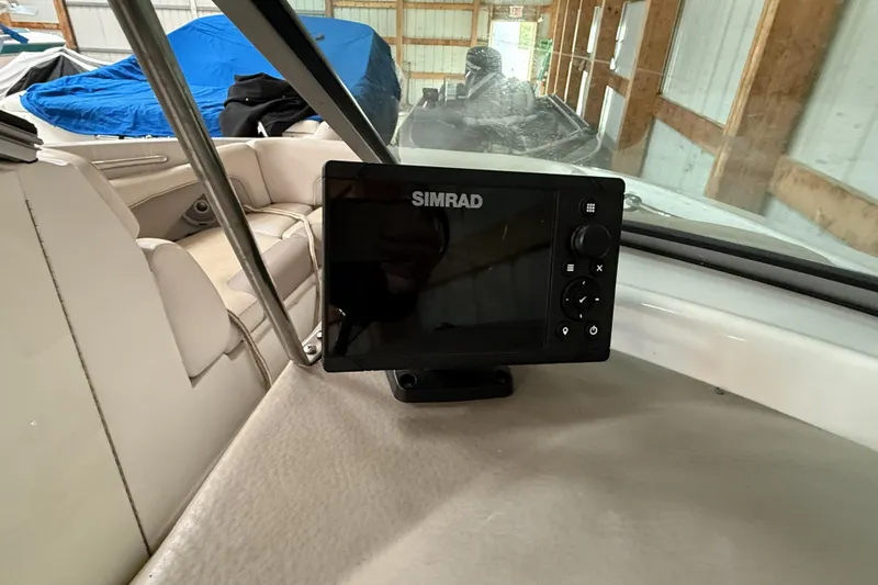 Slide: The Image of Simrad navigation system inside a 2015 Crownline Eclipse E2 XS boat. - 12