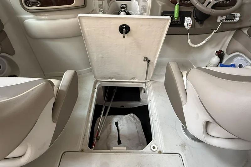 Slide: The Image of 2015 Crownline Eclipse E2 XS boat interior with open storage compartment. - 18