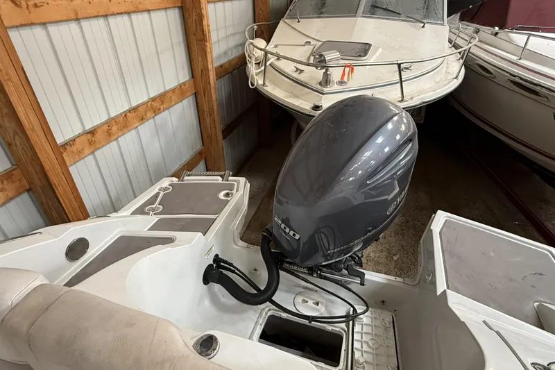 Slide: The Image of 2015 Crownline Eclipse E2 XS boat with Yamaha outboard motor in storage. - 22