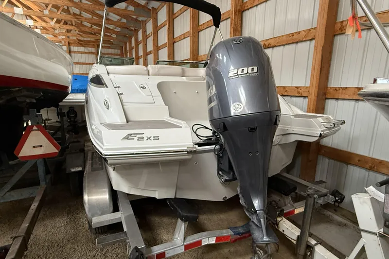 Slide: The Image of 2015 Crownline Eclipse E2 XS boat with Yamaha 200 engine in storage. - 24