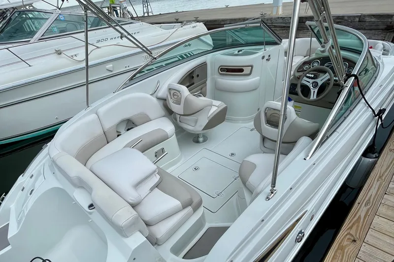 Slide: The Image of 2015 Crownline Eclipse E2 XS boat interior with plush seating and modern dashboard. - 3