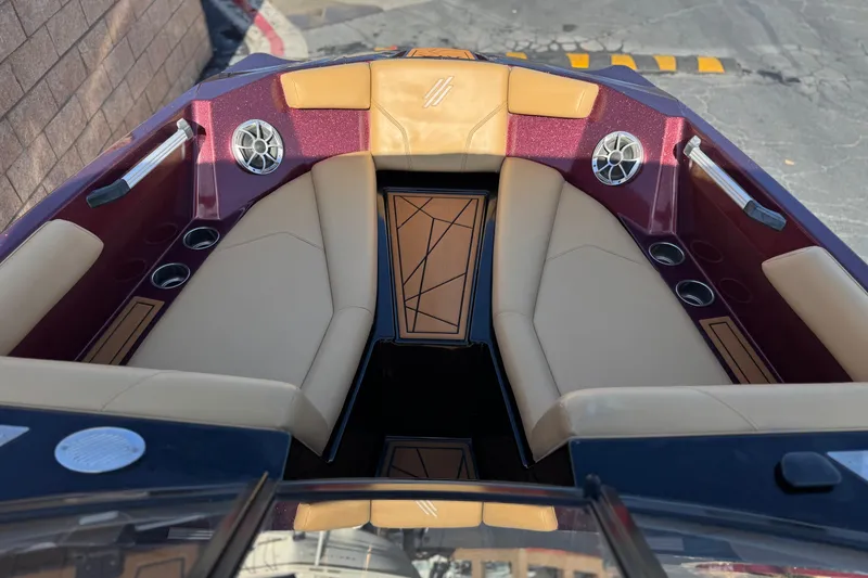 Slide: The Image of Interior of a 2020 ATX 22 TYPE S boat with tan seating and cup holders. - 10