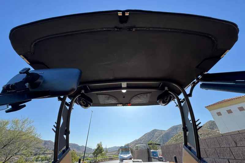 Slide: The Image of 2020 ATX 22 TYPE S boat canopy with speakers, mountain view background. - 13