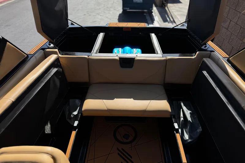 Slide: The Image of Interior of 2020 ATX 22 TYPE S boat with tan seating and storage compartments. - 18