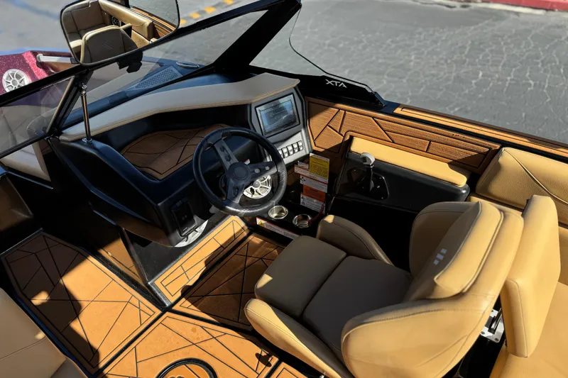 Slide: The Image of Luxurious interior of 2020 ATX 22 TYPE S boat with tan leather seats and modern dashboard. - 27