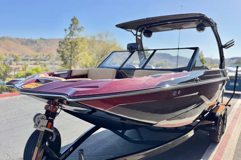 Slide: The Image of 2020 ATX 22 TYPE S boat on trailer, sleek design, parked outdoors. - 3