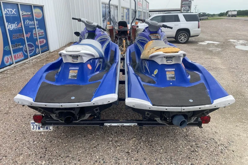 Slide: The Image of Two blue 2006 Yamaha WaveRunner VX Cruisers on a trailer, parked outside a dealership. - 4