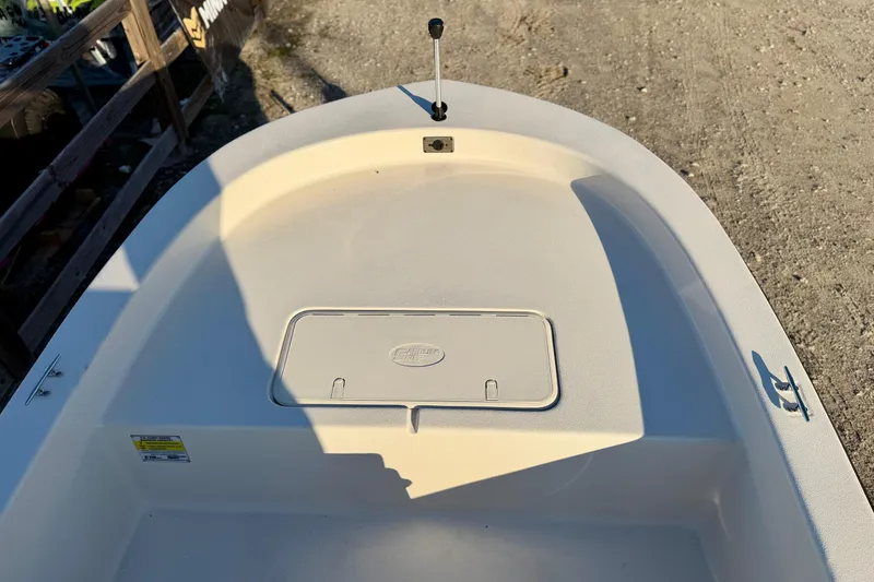 Slide: The Image of 2026 Carolina Skiff E18 JVX CC boat deck with storage compartment and cleat. - 11