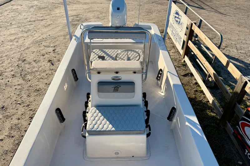 Slide: The Image of 2026 Carolina Skiff E18 JVX CC boat interior with seating and steering console. - 12