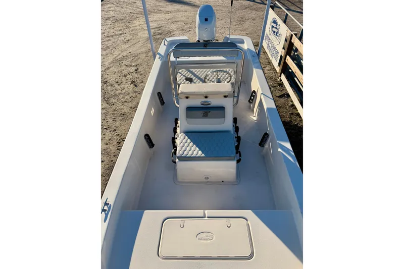 Slide: The Image of 2026 Carolina Skiff E18 JVX CC boat interior with seating and storage compartments. - 13