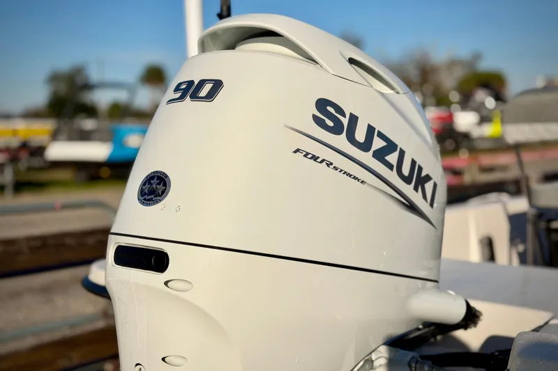 Slide: The Image of Suzuki 90 horsepower outboard motor on 2026 Carolina Skiff E18 JVX CC boat. - 3
