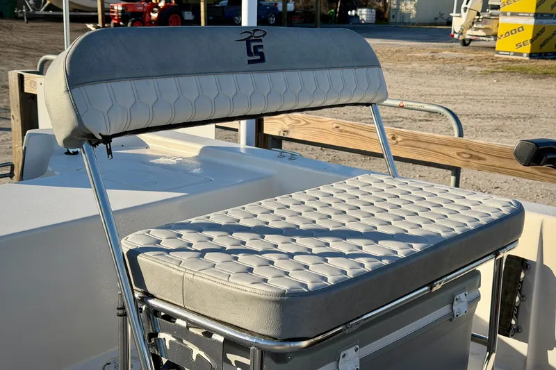 Slide: The Image of 2026 Carolina Skiff E18 JVX CC boat seat with stylish, cushioned design and durable metal frame. - 8
