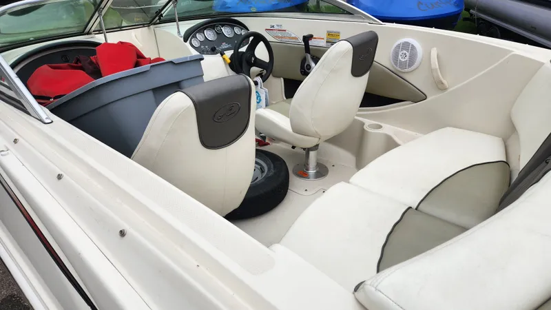 Slide: The Image of Interior of a 2006 Sea Ray 195 Sport boat with white seating. - 10