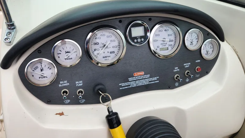 Slide: The Image of Dashboard of a 2006 Sea Ray 195 Sport boat with gauges. - 12