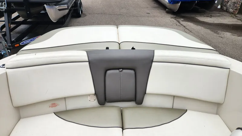 Slide: The Image of Interior of a 2006 Sea Ray 195 Sport boat, white upholstery. - 15