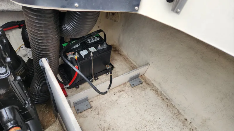 Slide: The Image of Battery compartment of a 2006 Sea Ray 195 Sport boat. - 18