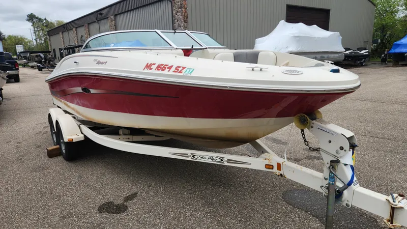 Slide: The Image of 2006 Sea Ray 195 Sport boat parked on trailer. - 2
