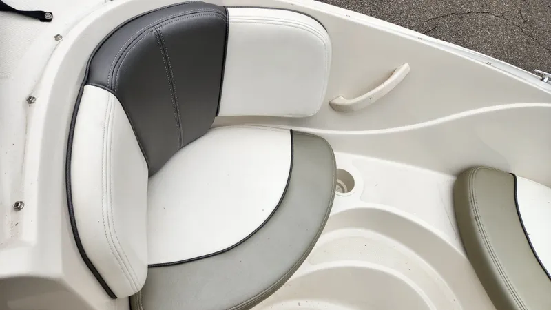 Slide: The Image of Interior of a 2006 Sea Ray 195 Sport boat with cushioned seats. - 23
