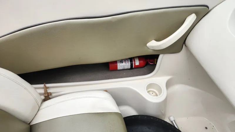 Slide: The Image of Interior of a 2006 Sea Ray 195 Sport boat with fire extinguisher. - 29