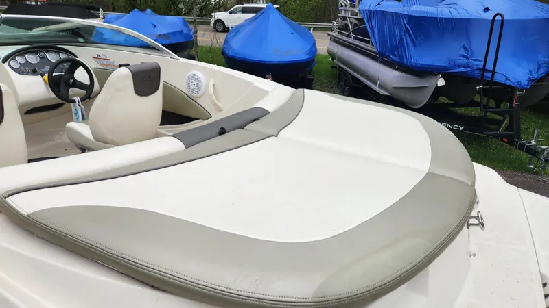 Slide: The Image of Interior of a 2006 Sea Ray 195 Sport boat, with blue covers in background. - 9