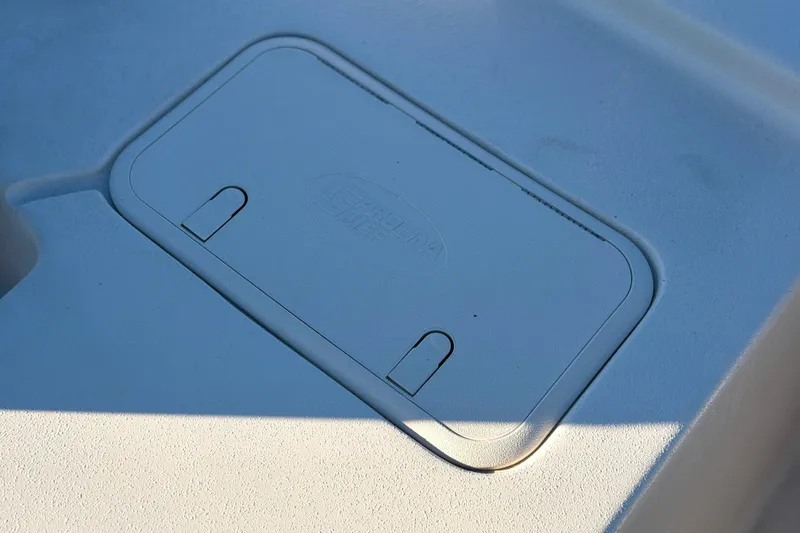 Slide: The Image of Hatch cover on 2026 Carolina Skiff E18 JVX CC boat deck. - 14