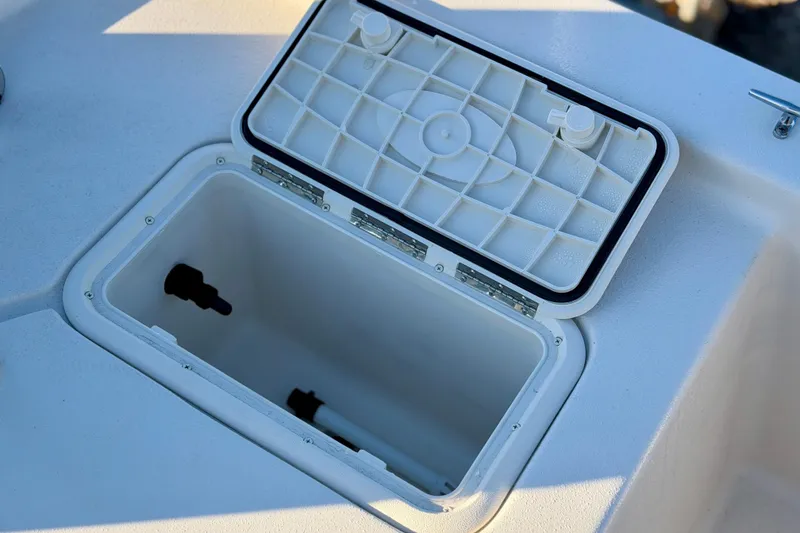 Slide: The Image of Open storage compartment on 2026 Carolina Skiff E18 JVX CC boat. - 15