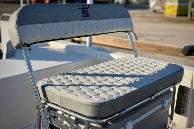 Slide: The Image of 2026 Carolina Skiff E18 JVX CC boat seat with textured upholstery and metal frame. - 3