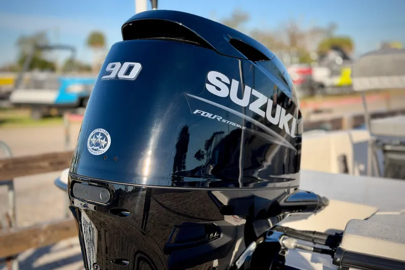 Slide: The Image of Suzuki 90 horsepower outboard motor on 2026 Carolina Skiff E18 JVX CC boat. - 5