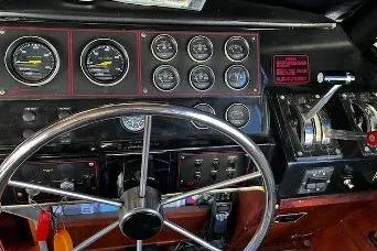 Slide: The Image of Dashboard of a 1985 Bayliner 3270 Motoryacht with gauges and steering wheel. - 10