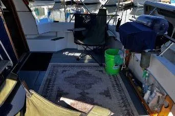 Slide: The Image of Interior of a 1985 Bayliner 3270 Motoryacht with carpet and chairs. - 2