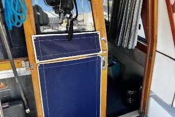 Slide: The Image of 1985 Bayliner 3270 Motoryacht interior with wooden door and canvas panel. - 20