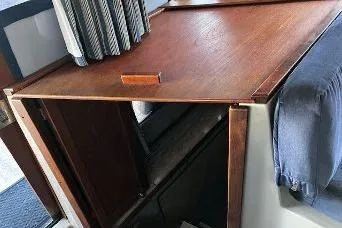 Slide: The Image of 1985 Bayliner 3270 Motoryacht entrance to lower cabin with wooden cabinetry and curtains. - 6
