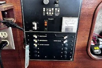 Slide: The Image of Control panel of a 1985 Bayliner 3270 Motoryacht with switches and gauges. - 9