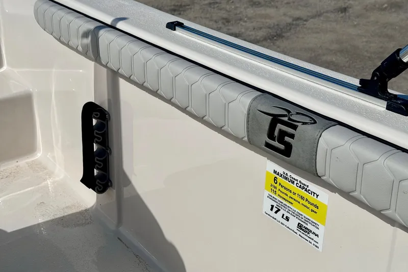Slide: The Image of 2025 Carolina Skiff 17 LS boat interior with capacity label and logo detail. - 10