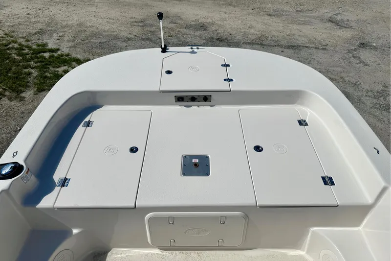 Slide: The Image of 2025 Carolina Skiff 17 LS boat deck with storage compartments and clean design. - 11