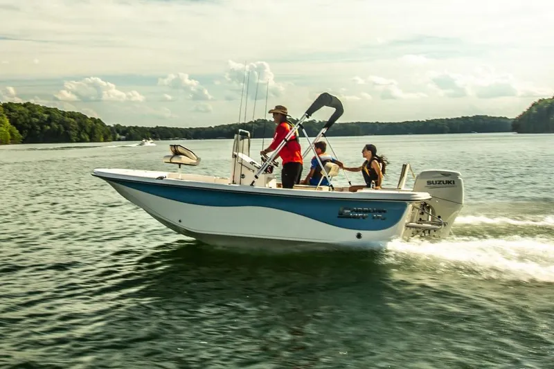 Slide: The Image of Manufacturer Provided Image: 2025 Carolina Skiff 17 LS boat cruising on a lake with passengers. - 15