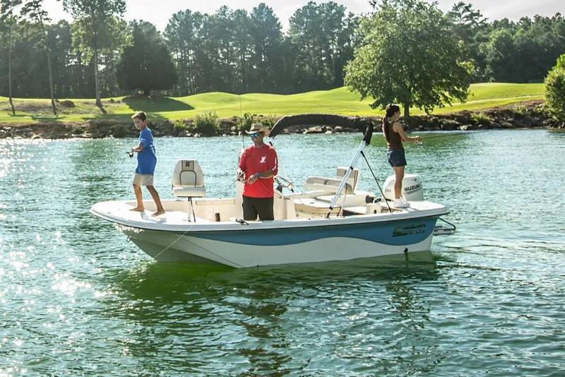 Slide: The Image of Manufacturer Provided Image: 2025 Carolina Skiff 17 LS boat on a lake with three people fishing. - 16