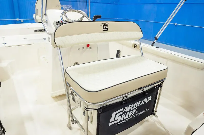 Slide: The Image of Manufacturer Provided Image: 2025 Carolina Skiff 17 LS boat interior with cushioned seating and steering console. - 20