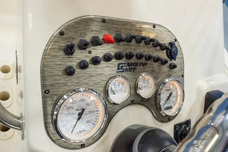 Slide: The Image of Manufacturer Provided Image: Dashboard of a 2025 Carolina Skiff 17 LS boat with gauges and controls. - 22
