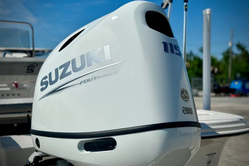 Slide: The Image of 2025 Carolina Skiff 17 LS with Suzuki 115 outboard motor, sunny day background. - 3
