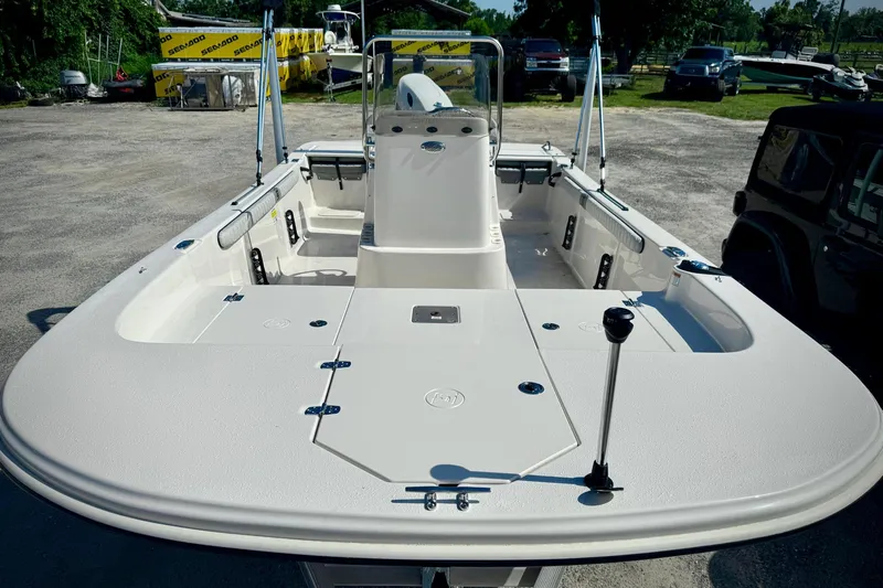 Slide: The Image of 2025 Carolina Skiff 17 LS boat, spacious deck, parked outdoors. - 4