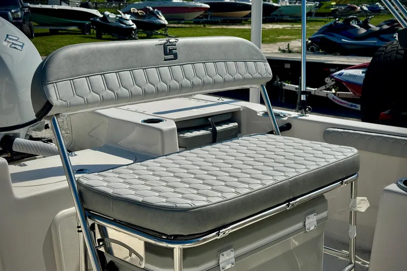 Slide: The Image of 2025 Carolina Skiff 17 LS boat interior with cushioned seating and storage. - 5